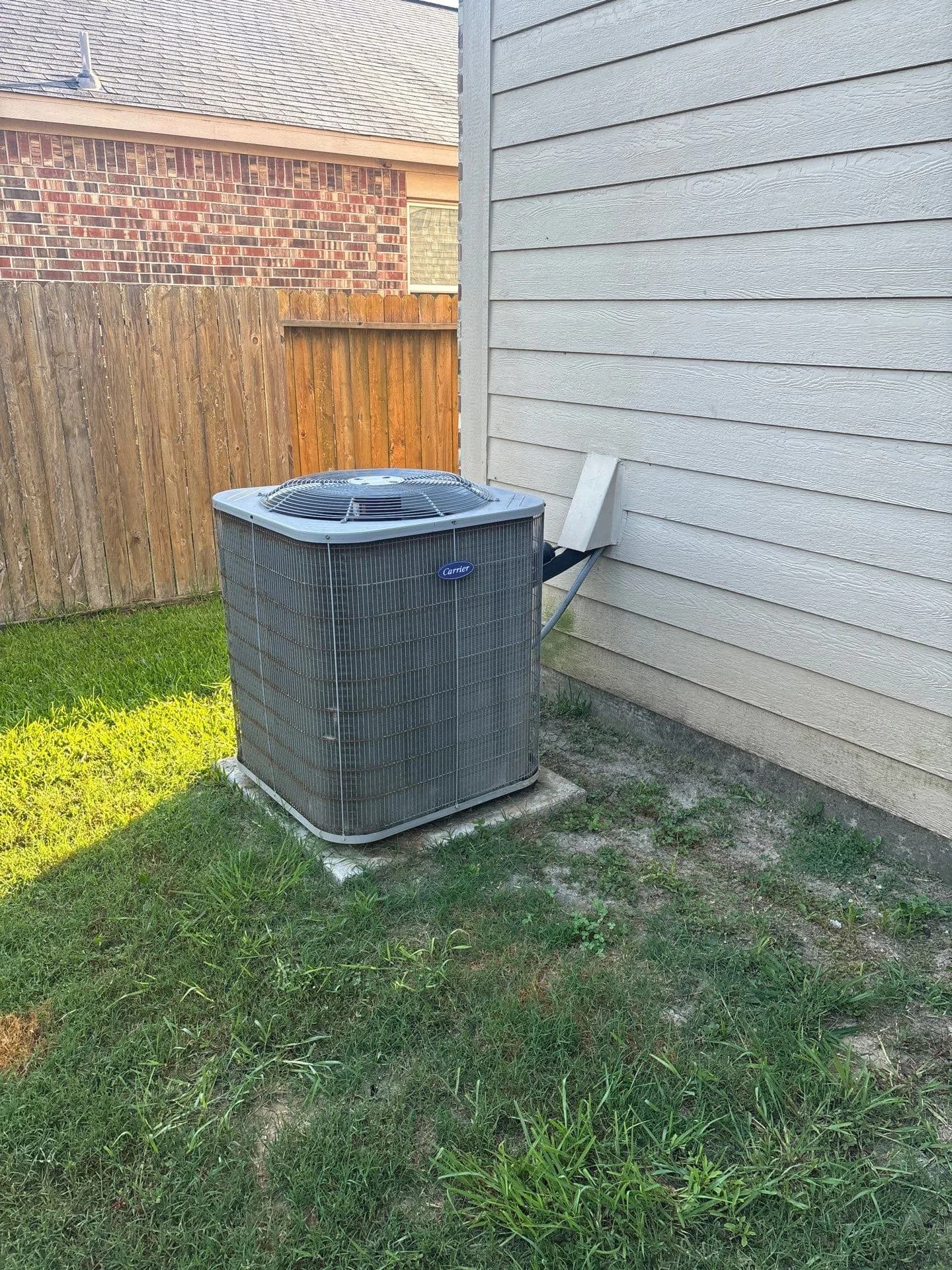 Outdoor air conditioning unit installed at a residential property