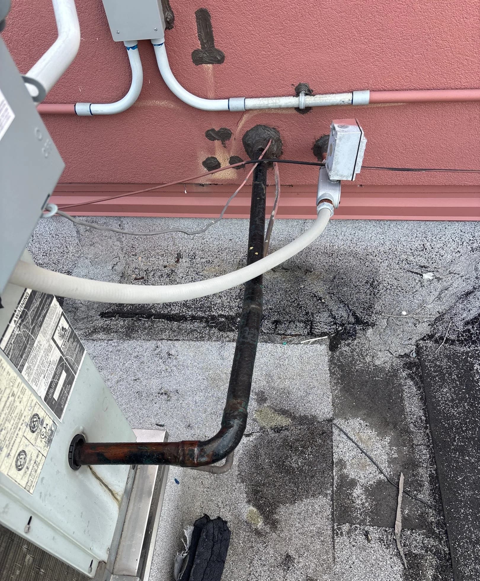 Exposed Refrigerant Lines on a Commercial Roof in Dickinson